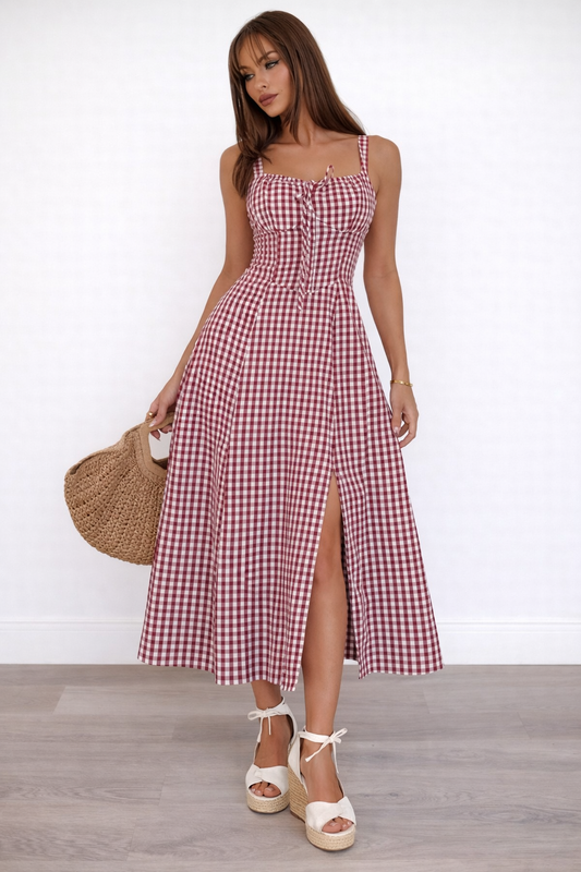 red gingham midi dress front view with fitted bodice and side slit
