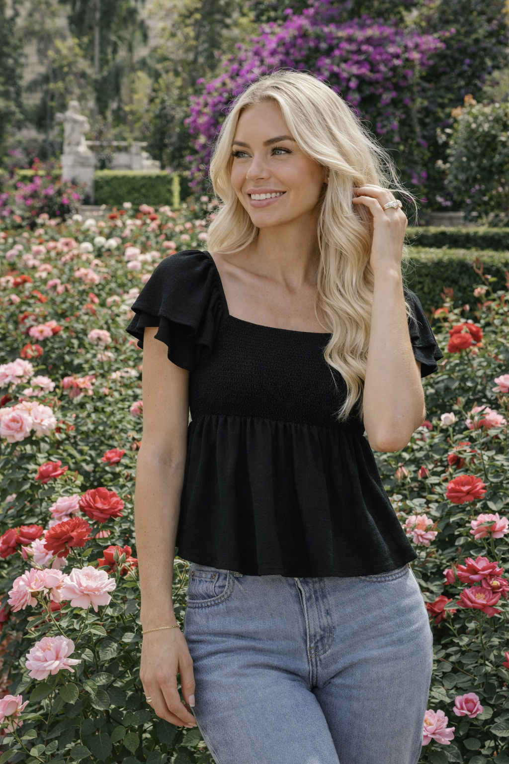 Black smocked bust peplum top ruffle sleeves — RIVI Riviera Evenings