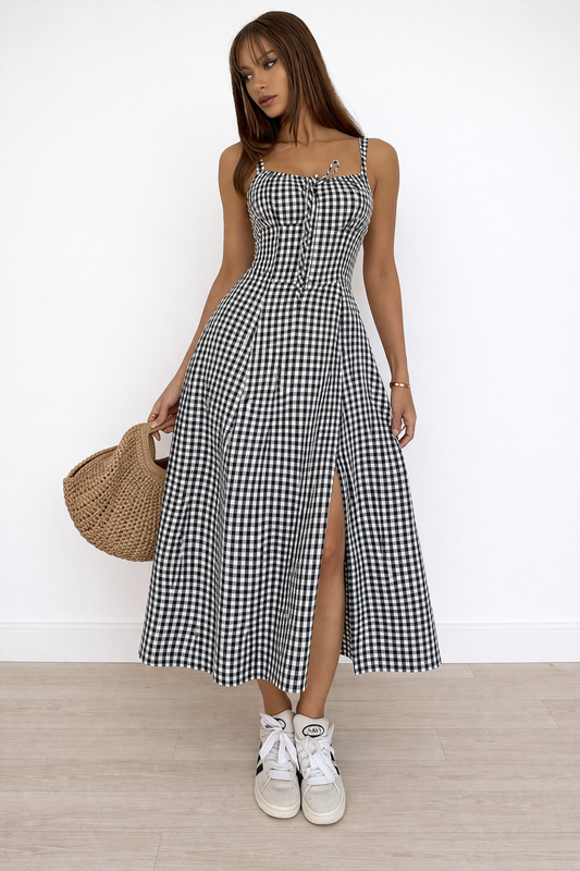 black gingham midi dress front view with fitted bodice and side slit