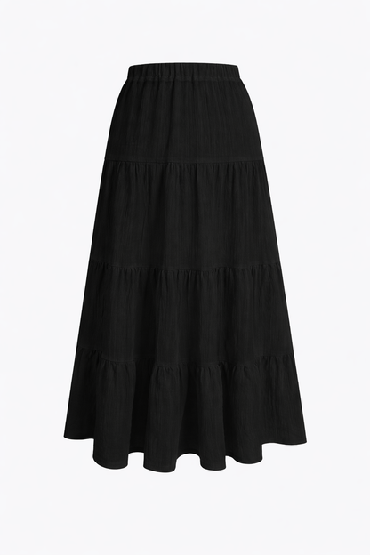 Black tiered maxi skirt close-up — elastic waistband drawstring detail — RIVI